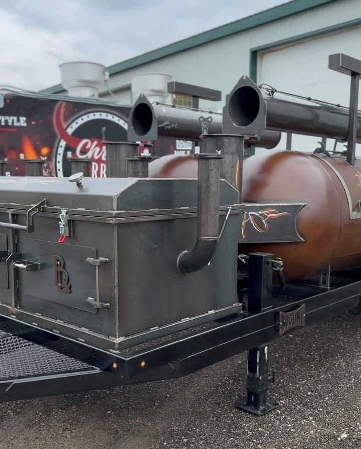 Chris's County Barbecue twin 1000-gallon trailer with a direct-heat pit up front