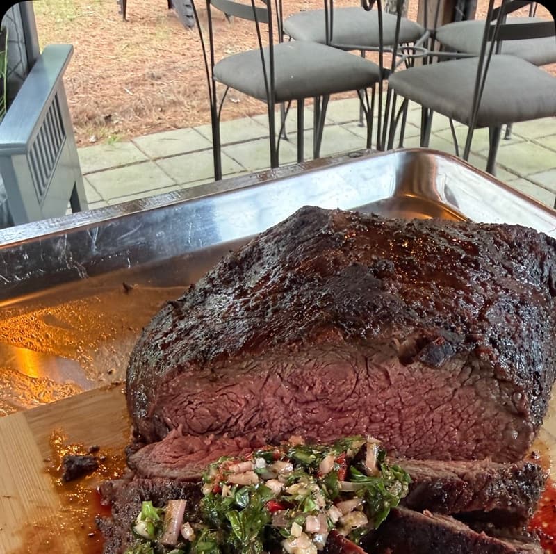 Picanha grilled over live fire on the Bog Line campfire cook pit