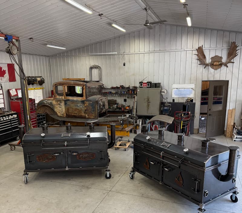 Inside the Bog Line shop in Parkhill, Ontario: smokers on the floor and a patina hot rod in the bay